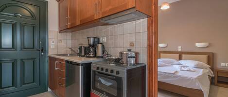 Fridge, oven, coffee/tea maker, cookware/dishes/utensils