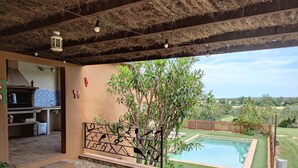 An outdoor patio with a pool, a grill, and a view of the surrounding landscape. - Self catering Can Nentia for 9 people (Forallac)