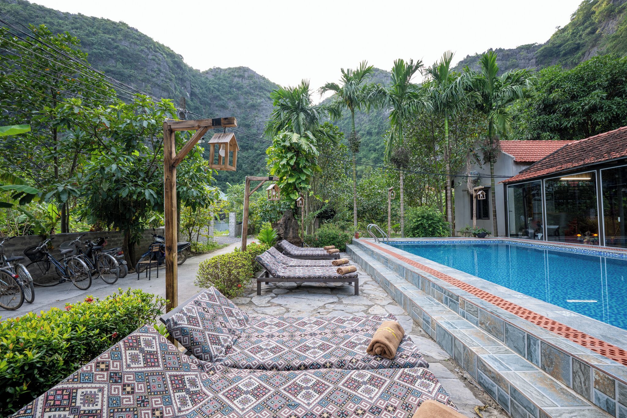 A poolside area with lounge chairs and a small pool.