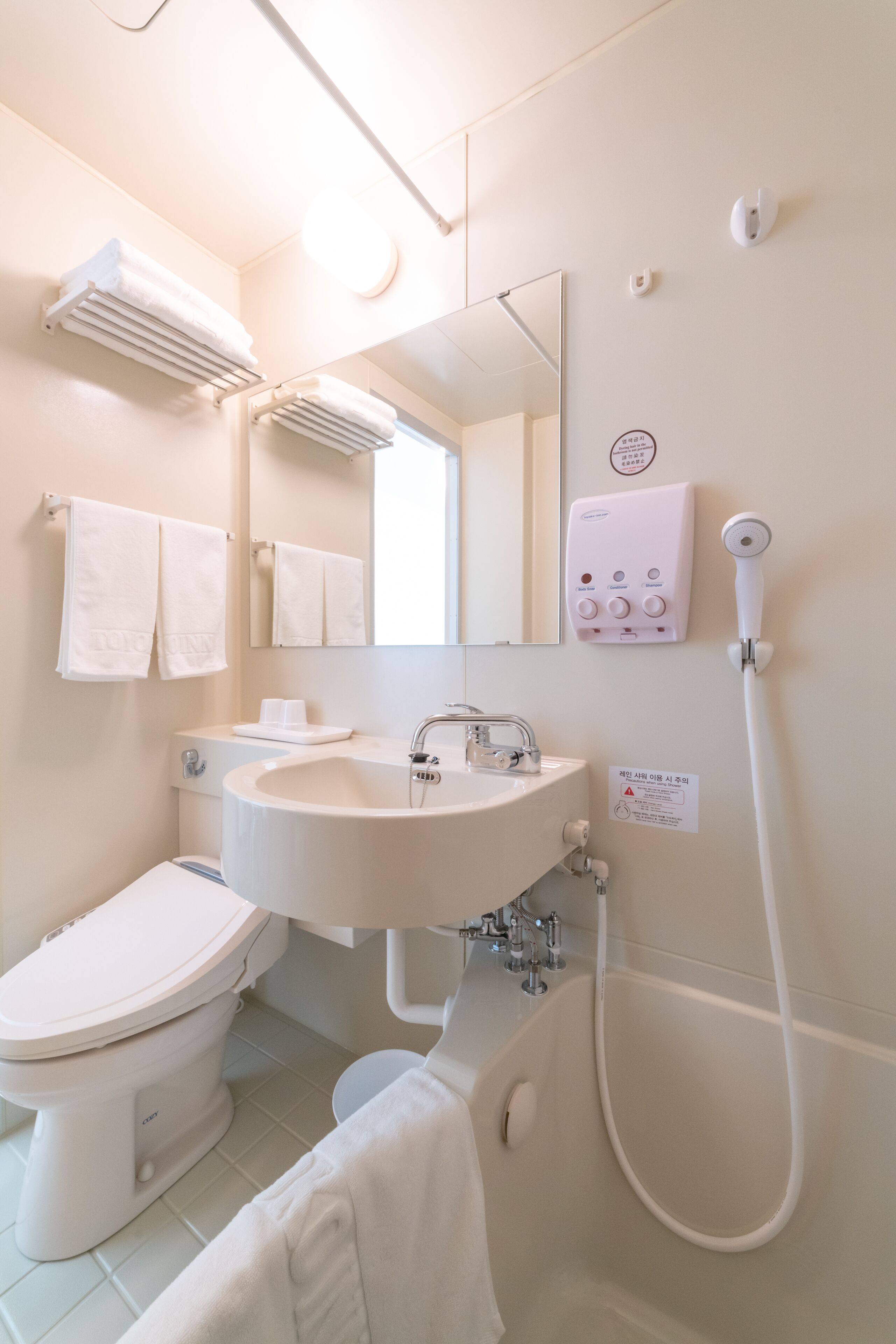 combined shower/bathtub, free toiletries, hair dryer, slippers