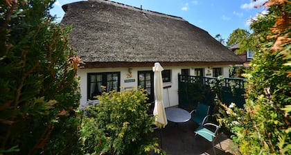 Historical Thatched with a separate entrance with transom windows and shutters