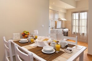Enjoy cooking and dining in this well-equipped kitchen with a dining table and modern appliances.