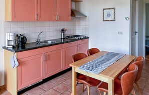 Fridge, stovetop, dishwasher, coffee/tea maker