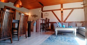 Flat-screen TV, DVD player, books, music library