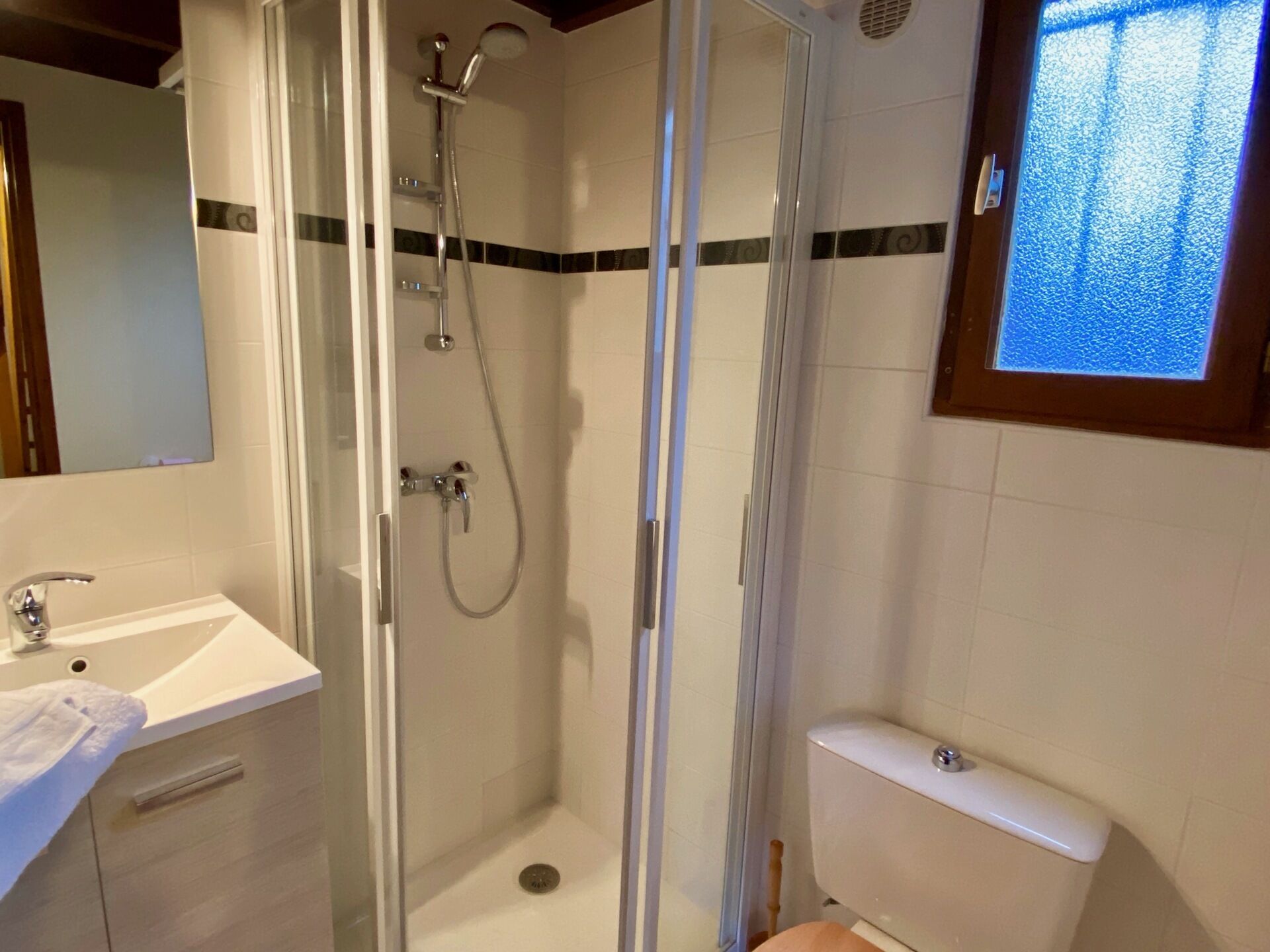 Shower, towels, toilet paper