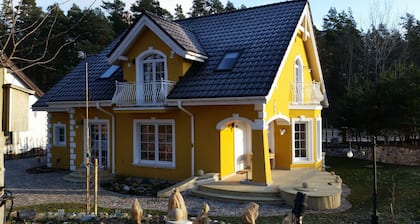 Small yellow villa in Masuria (apartment WEST in the attic)