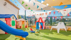 A children's play area with a slide, playhouses, and a tent. - Lovely home in Tallante (Tallante)