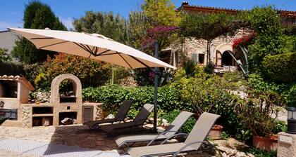 Relaxation in Mediterranean garden landscape at the large private pool