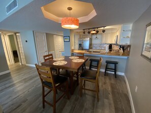 Enjoy meals in this well-equipped kitchen with a central island, oven, and dining area.