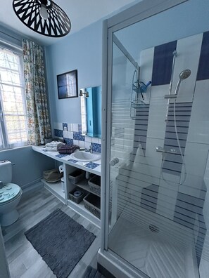Shower, hair dryer, towels, soap