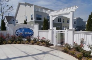 A gated entrance with a sign reading "Shoal Harbor."