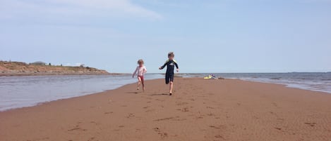 On the beach, sun loungers, beach towels