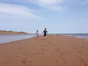 On the beach, sun loungers, beach towels