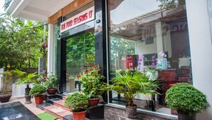 A storefront with a sign reading "BLUE FOUR SEASONS IT". - Hue Four Seasons Hotel (Hue)