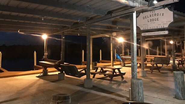 The Delacroix Lodge with outdoor seating and a covered patio area.