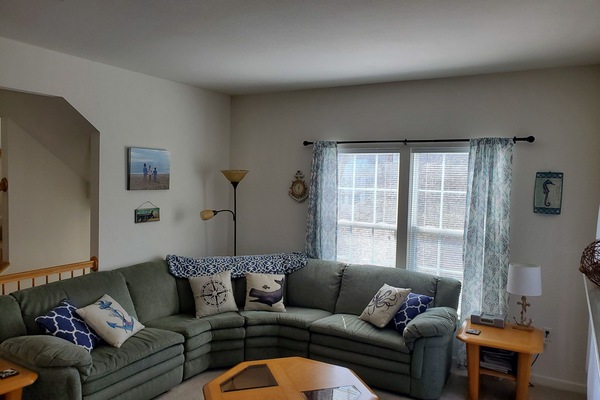 Main living room area with access to outside deck