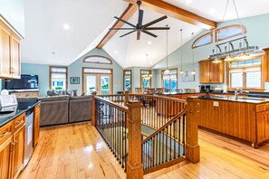 Enjoy a spacious room with a dining area, kitchen, and seating space.