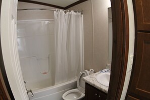 Combined shower/tub, hair dryer, towels, soap - Ben Ranch Cabin #1 . Located in century old Pecan Orchard, historic Osage County (Ralston)