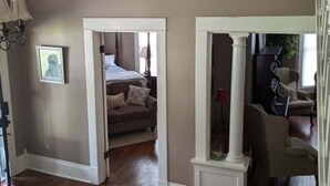 A spacious room with a large bed, a sitting area with a sofa, and a dining area with a table and chairs. - The Gate House (Entire House) (Lancaster)