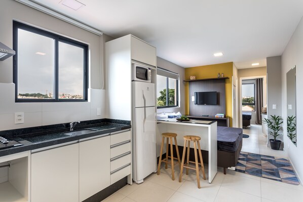 Fridge, microwave, stovetop, coffee/tea maker