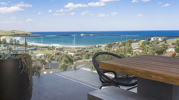 A balcony with a view of the ocean and a town. - Cosmopolitan@SoHo -  amazing views (Gerringong)