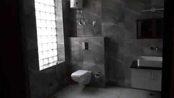 Deluxe Room, 1 King Bed, Smoking | Bathroom | Slippers, towels
