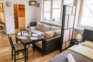 Enjoy a meal at the dining table, then relax on the sofa with a view of the outdoors.