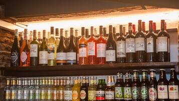 A bar with shelves of wine and spirits.
