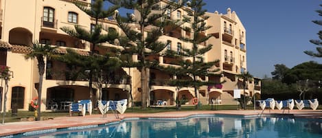 Outdoor pool, open 8:00 AM to 10:00 PM, sun loungers