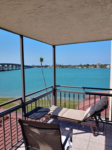 Immaculate Condo. Pool, Jacuzzi. Balcony with waterfront and nightly sunset.