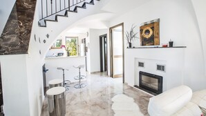 Family Villa, 3 Bedrooms, Private Pool | Living area | 40-inch flat-screen TV with satellite channels, TV, fireplace - Kymma Villas (Sotira)