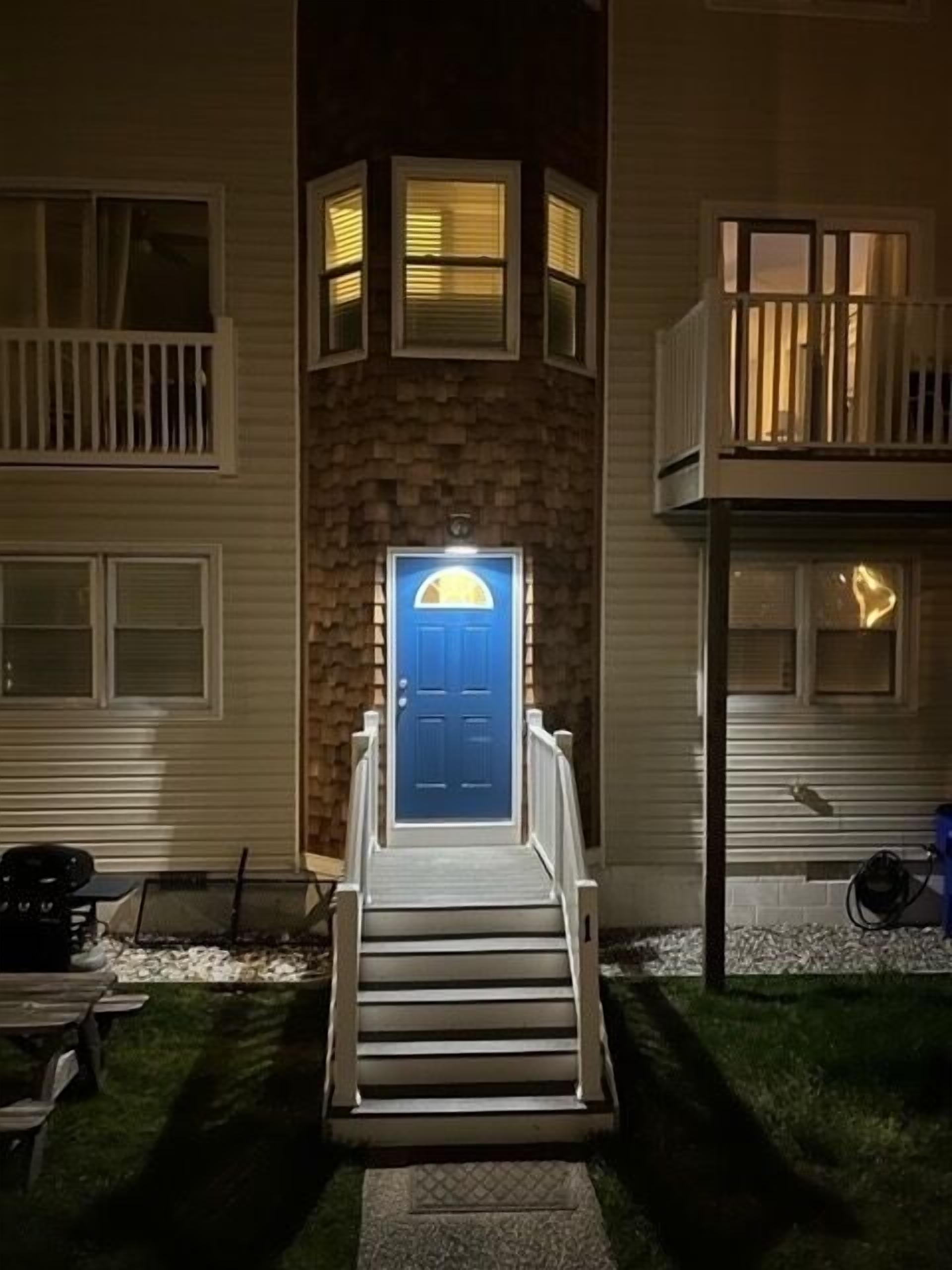 Nighttime view of well lit front entrance