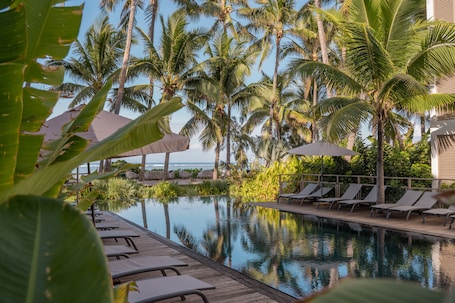 Outdoor pool, open 9:00 AM to 7:00 PM, pool umbrellas, pool loungers