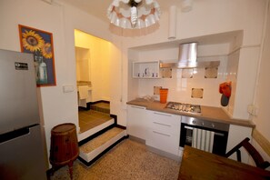 Apartment, 2 Bedrooms | Private kitchen | Fridge, oven, stovetop, cookware/dishes/utensils