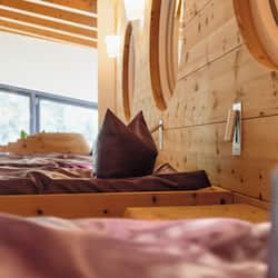 Enjoy a restful night's sleep in this inviting bedroom with a comfortable bed and a window offering a view of the outdoors.