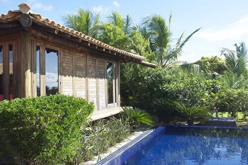 Scenic Waterfront Villa - Overflow  Pool & Tropical Landscape