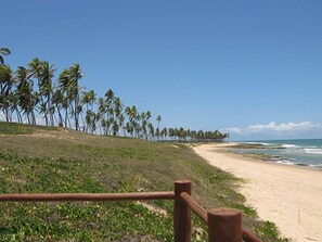 On the beach, sun loungers, beach towels