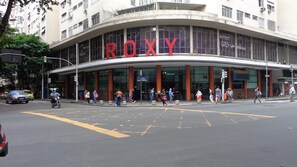 Welcome to ROXY, a modern building with a curved facade and large glass windows.