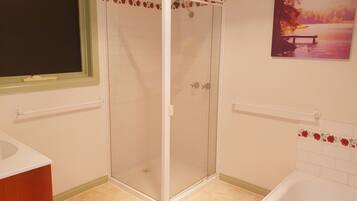 Bathtub, hair dryer, towels, soap