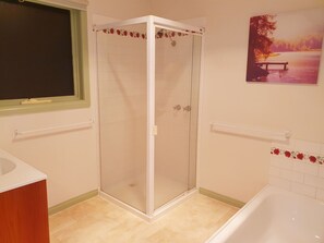 Bathtub, hair dryer, towels, soap