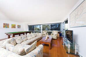 Flat-screen TV, DVD player, table tennis, books