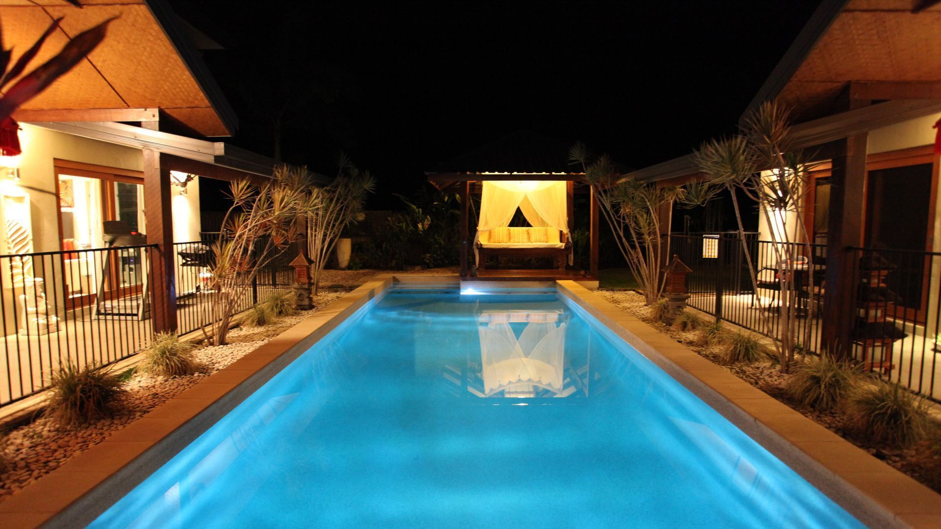 Beachside Bali inspired tropical retreat with large heated Saltwater pool.     \n — image 3