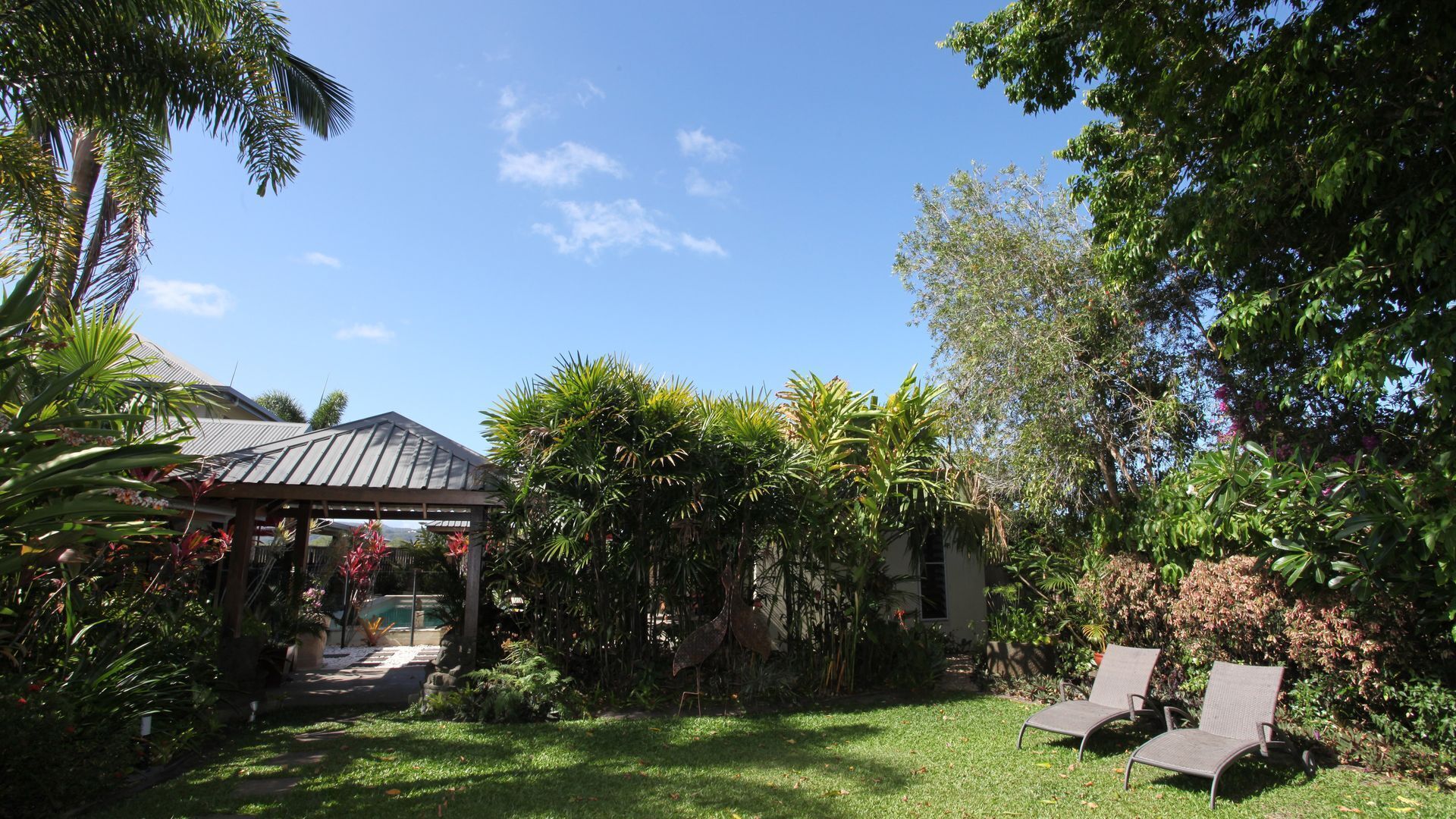 Beachside Bali inspired tropical retreat with large heated Saltwater pool.     \n — image 11