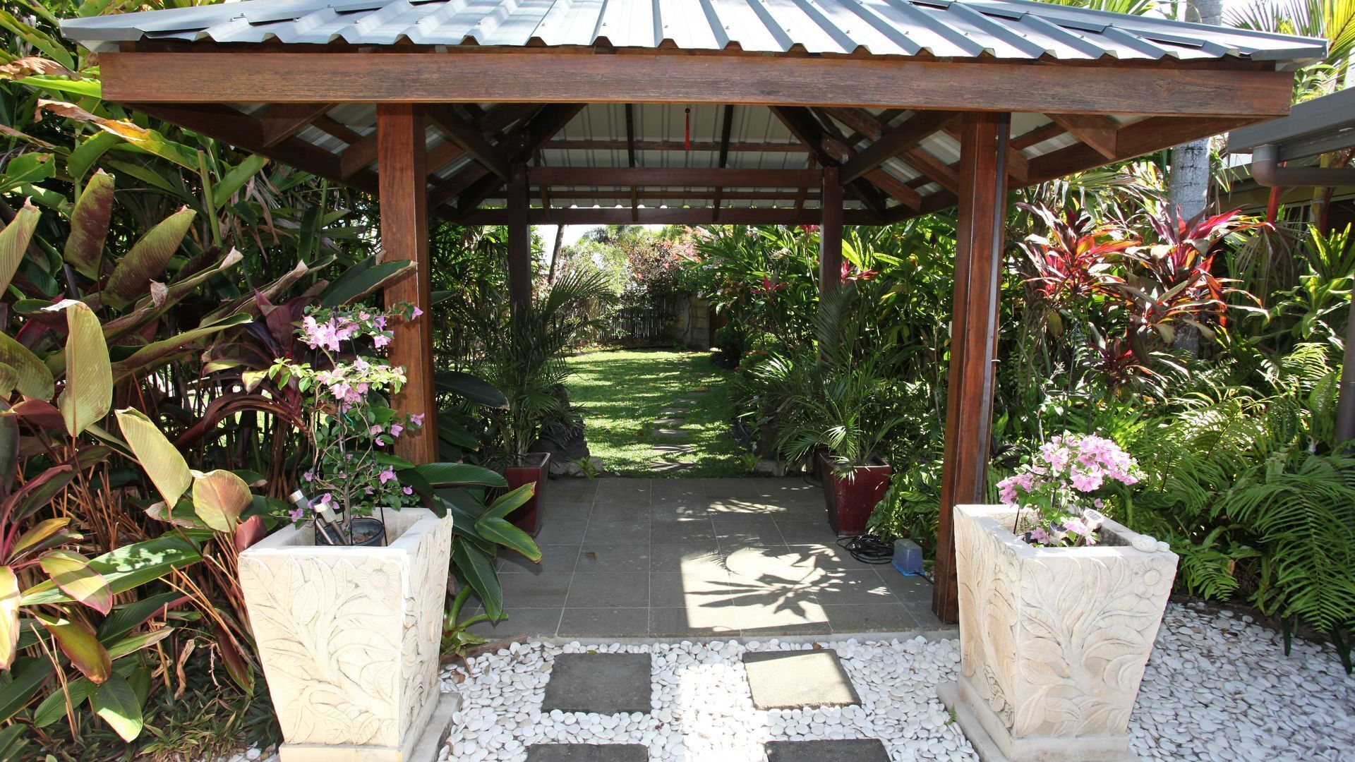 Beachside Bali inspired tropical retreat with large heated Saltwater pool.     \n — image 10