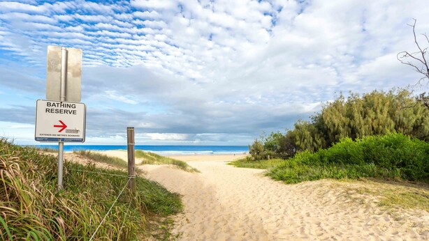 A beach path leading to a sign indicating a bathing reserve extending 800 meters seaward. - Two Bedroom Apartment - Unit 4 Foreshores (Sunshine Coast)