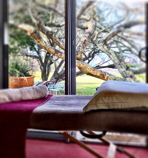 A room with a large window, a view of a tree outside, a bed with a red blanket, and a book on the bed. - Allview Escape - The Very Best Views in the Entire Blue Mountains - WOW FACTOR ! (Blackheath)