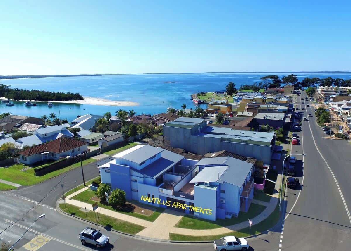 A coastal residential area with a prominent building labeled "NAUTILUS APARTMENTS".