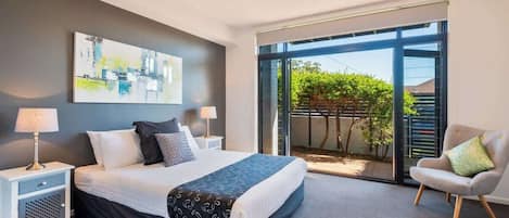 Ground Floor Queen bedroom opening onto private courtyard.