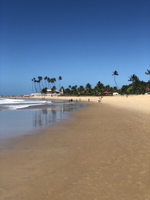 On the beach, sun-loungers