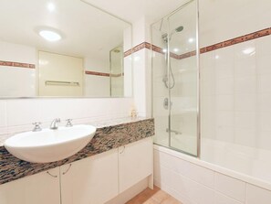 Combined shower/tub, towels, toilet paper